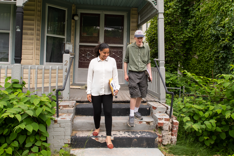Lanessa Chaplin of NYCLU canvasses the South Side neighborhood with volunteer Pete King. Their goal is to get the community more involved in the mega-project happening right across the street from their homes.